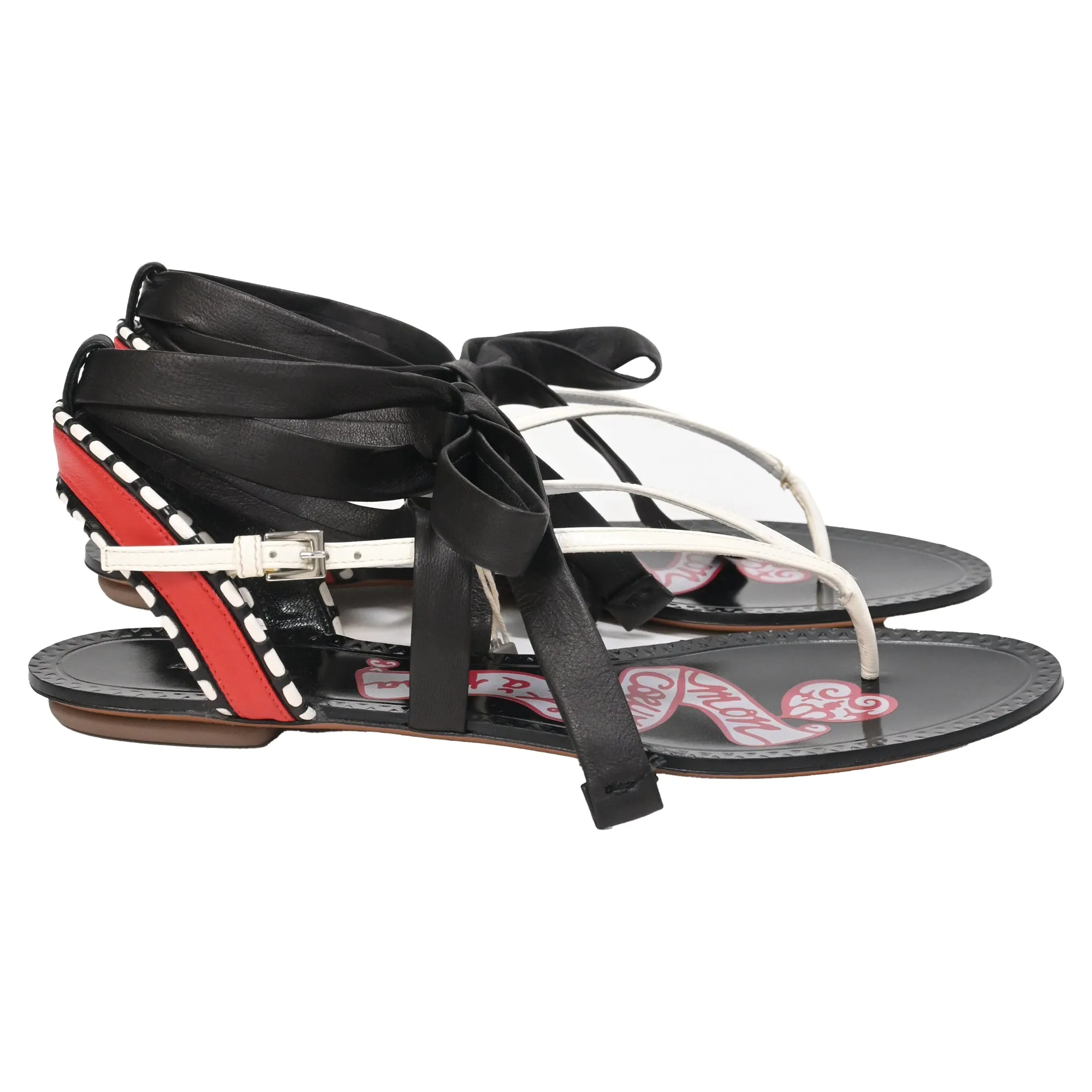 Alaïa Graphic Print Gladiator Sandals in Black Leather